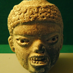 An Olmec Statue Head with fearsome appearance