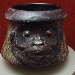 A Mayan bowl carved as a monkey head