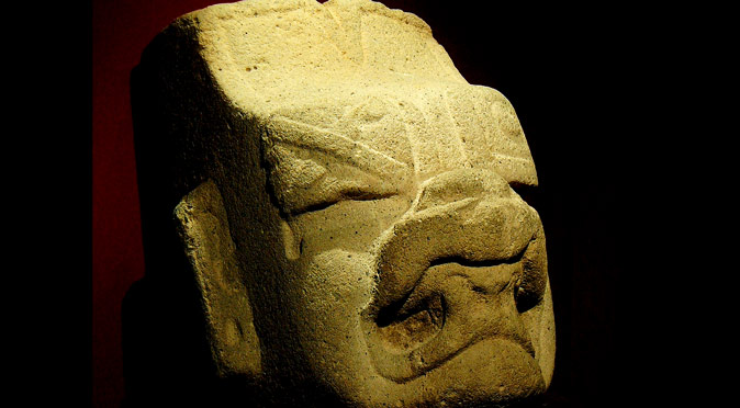 A statue head of the Olmec Were-Jaguar